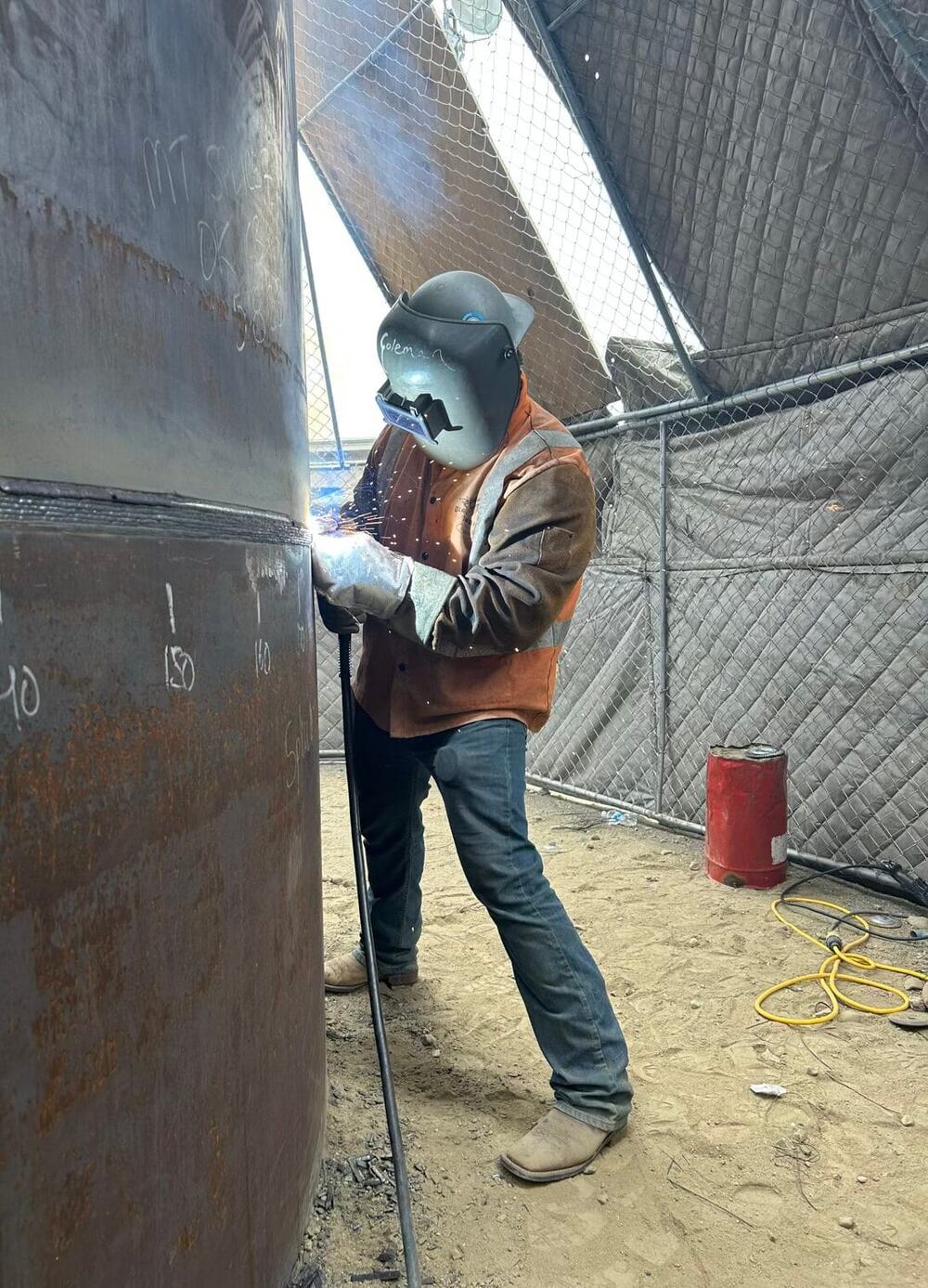 Nick Coleman welding on site