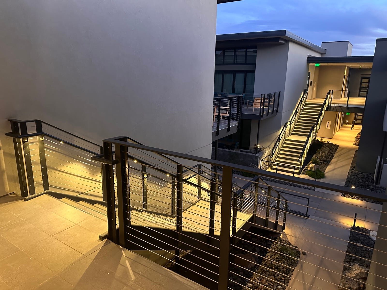 Stainless cable railing and lighted grab rail at Black Desert Resort, on-site fabrication