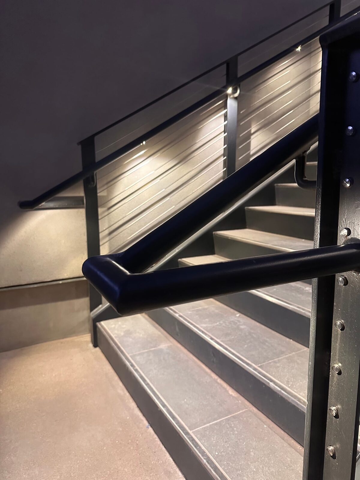 Stainless cable railing and lighted grab rail at Black Desert Resort, on-site fabrication