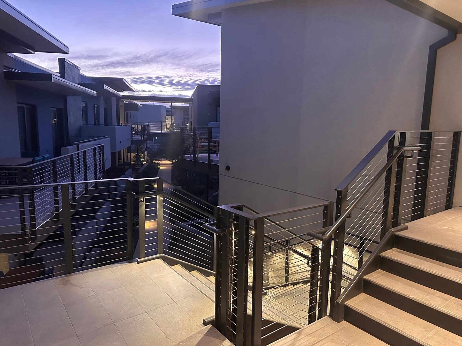 Stainless cable railing and lighted grab rail at Black Desert Resort, close-up