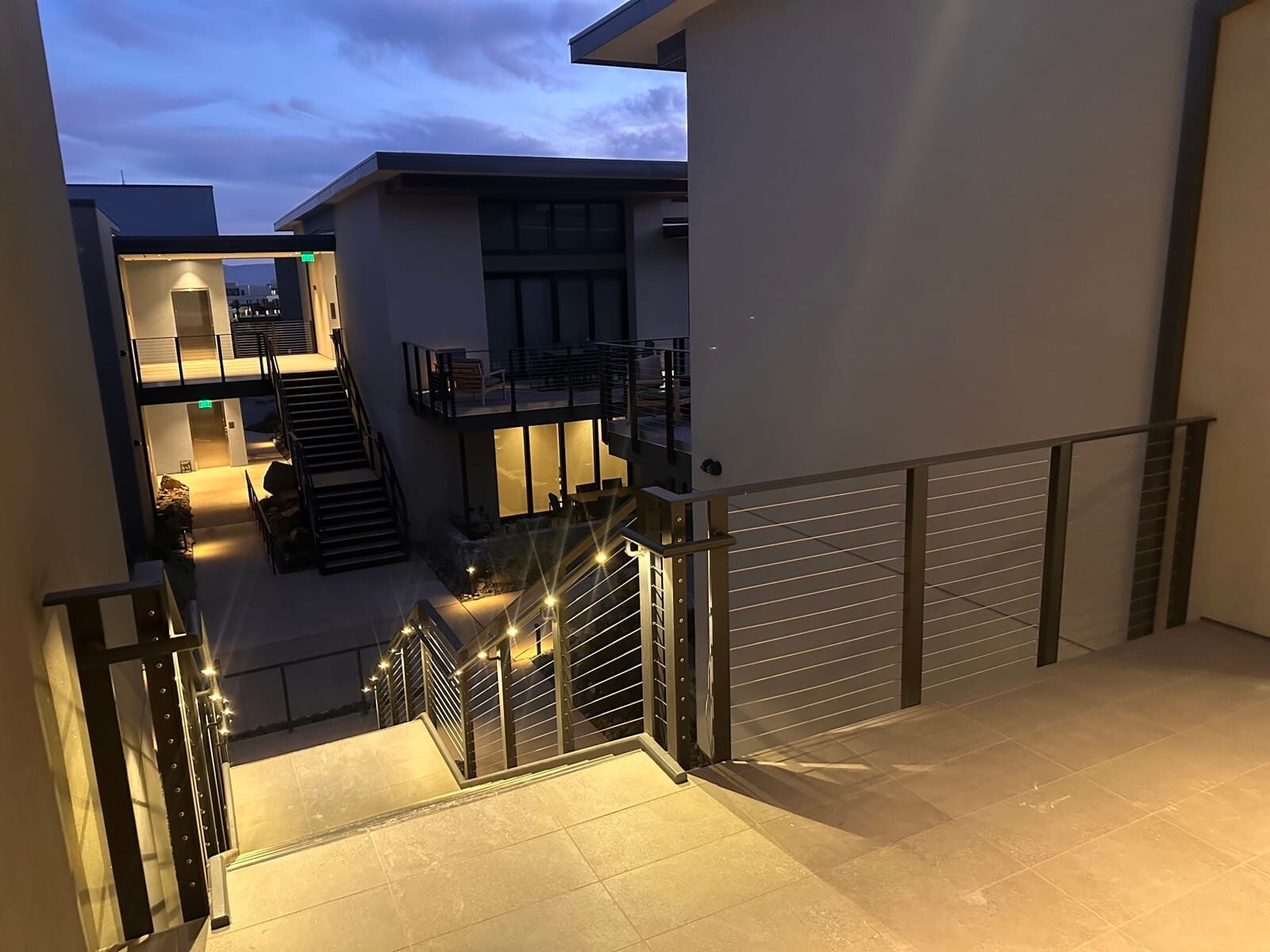 Stainless cable railing and lighted grab rail at Black Desert Resort, on-site fabrication