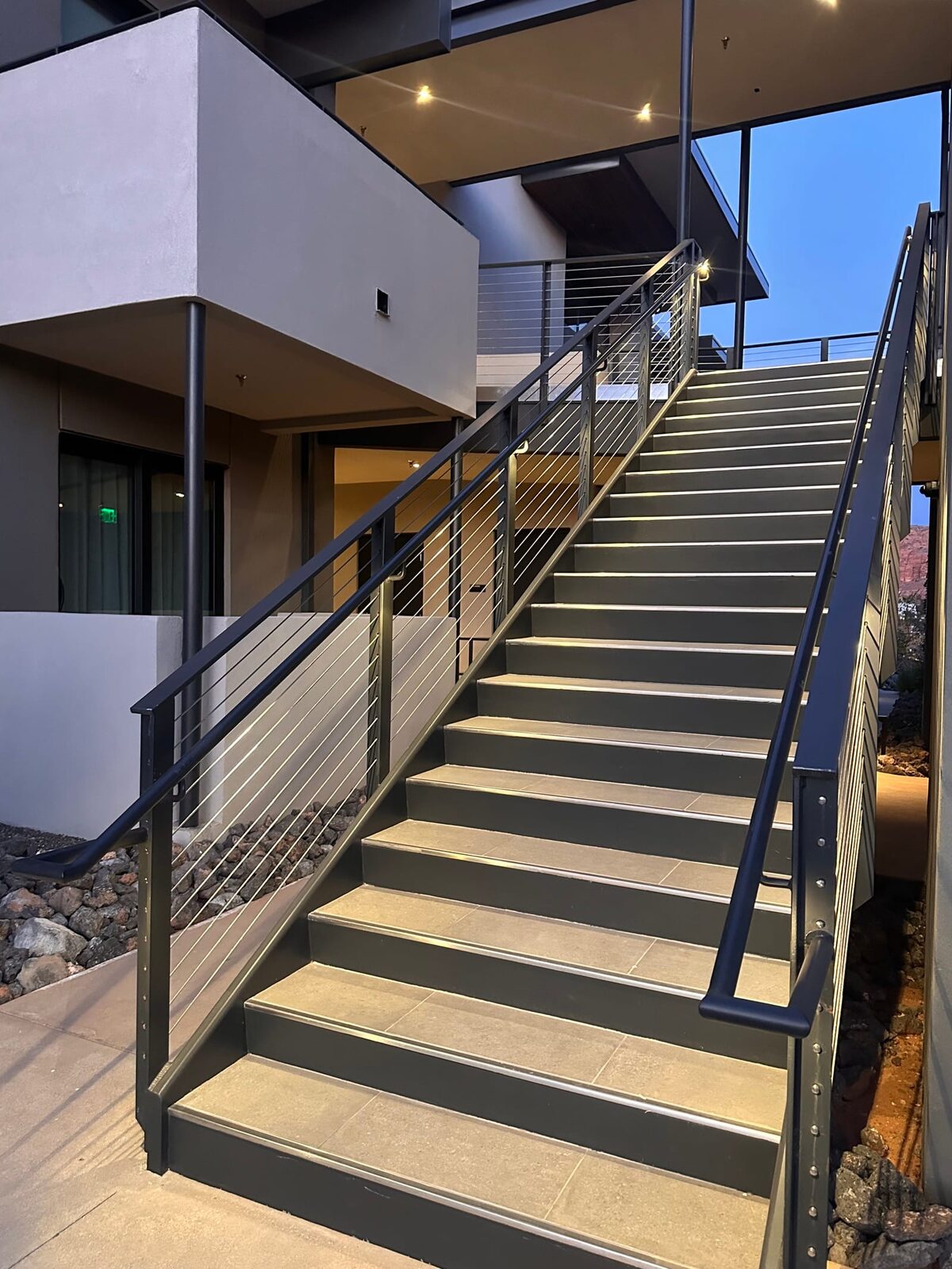 Stainless cable railing and lighted grab rail at Black Desert Resort, on-site fabrication