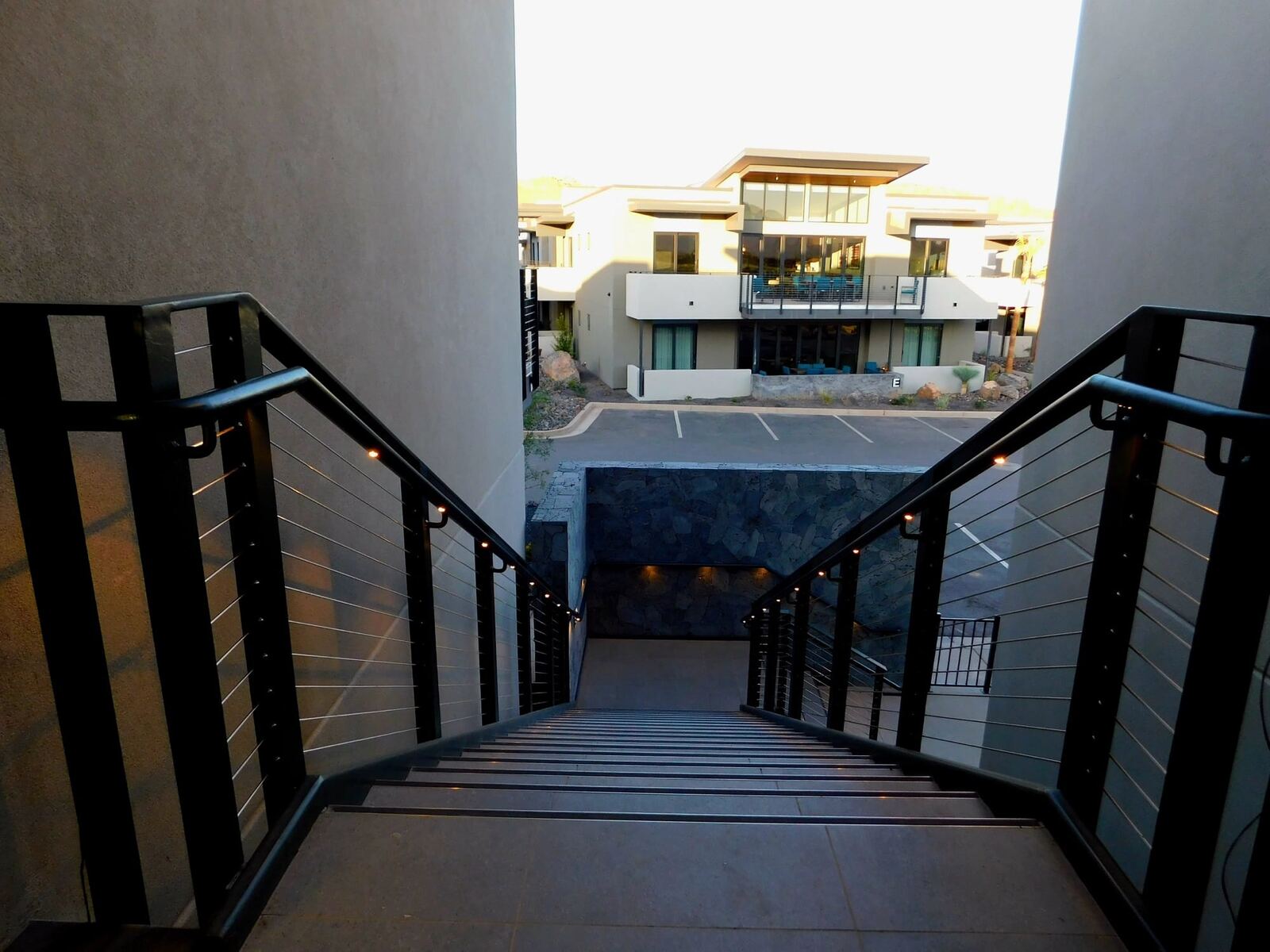 Stainless cable railings along a Black Desert Resort stairway