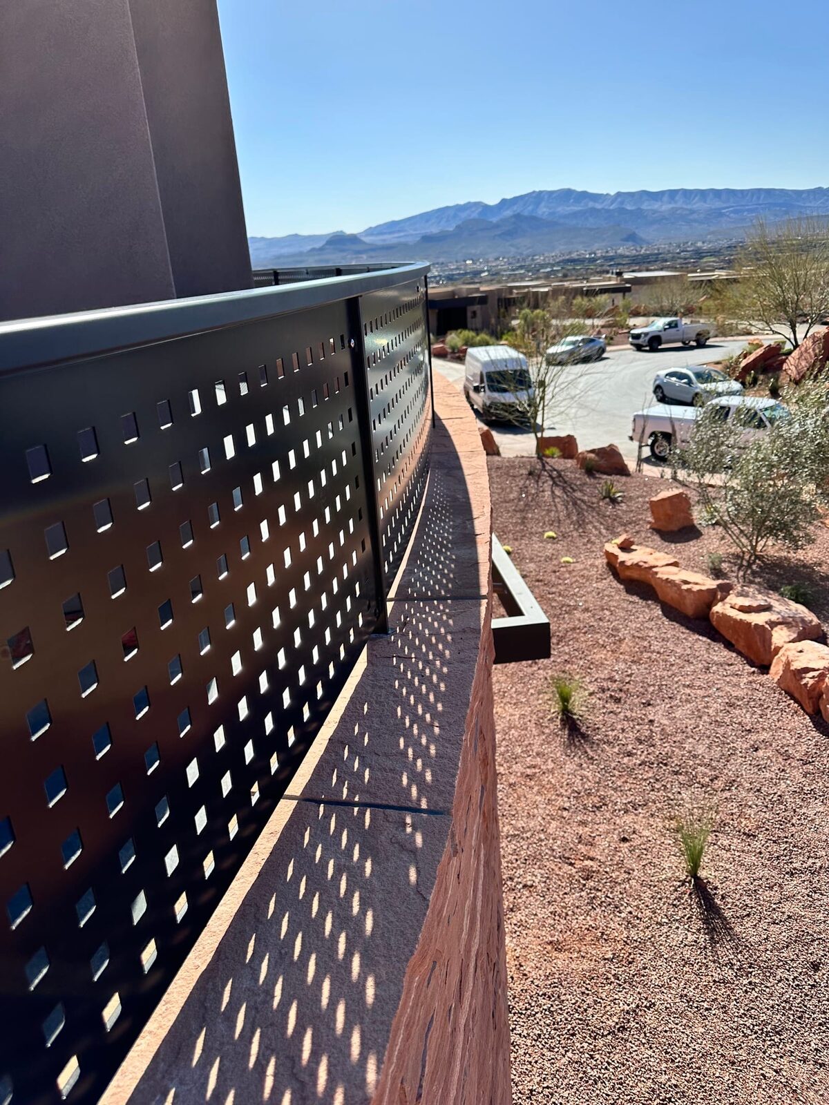 Custom radius steel railing following curved concrete at Entrada at Snow Canyon, detail