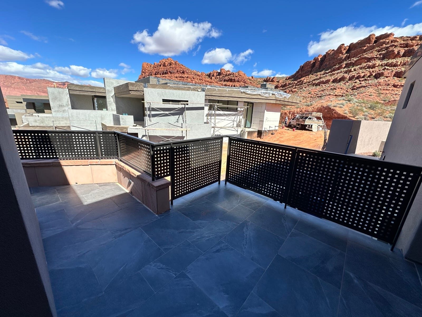 Custom radius steel railing following curved concrete at Entrada at Snow Canyon
