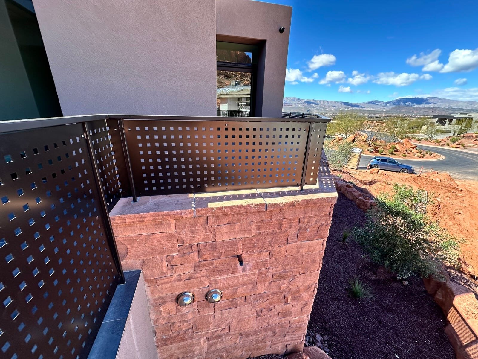 Custom radius steel railing following curved concrete at Entrada at Snow Canyon, detail