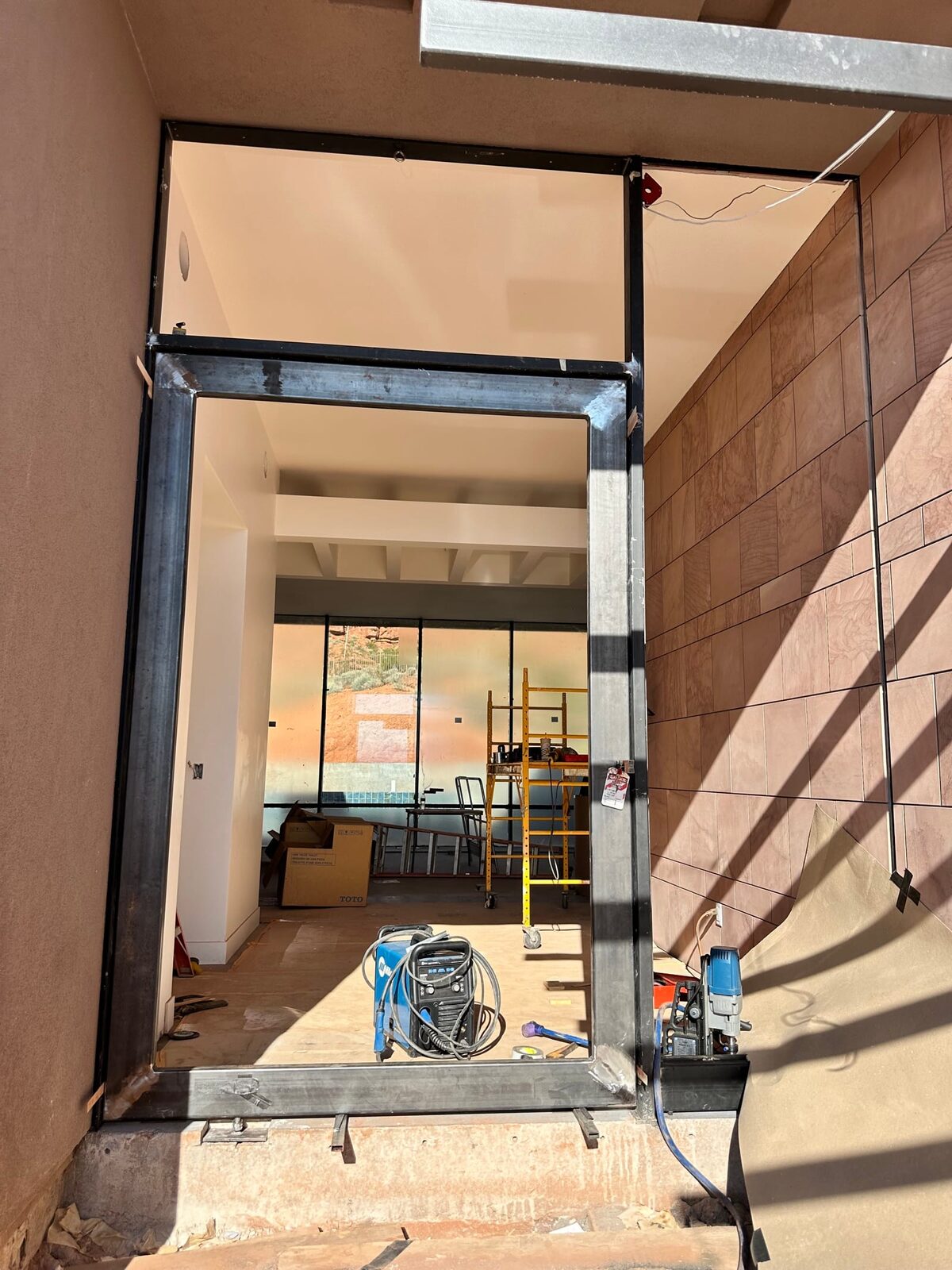 Custom steel grand entry door fabricated for the Entrada residence