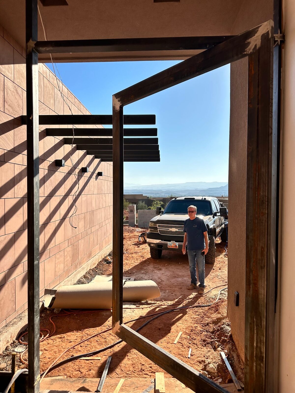Custom steel grand entry door fabricated for the Entrada residence