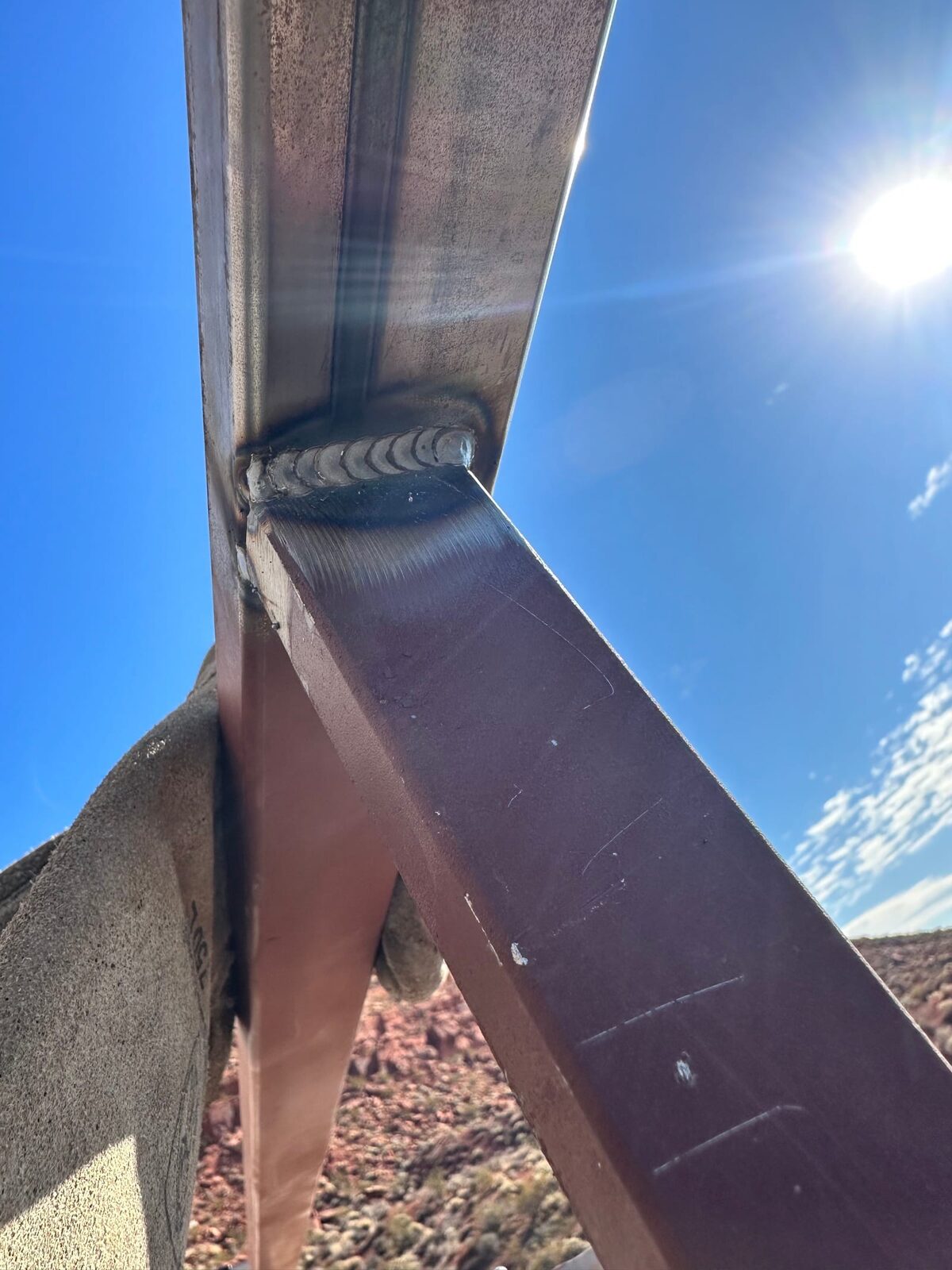 Custom radius steel railing following curved concrete at Entrada at Snow Canyon, on-site fabrication