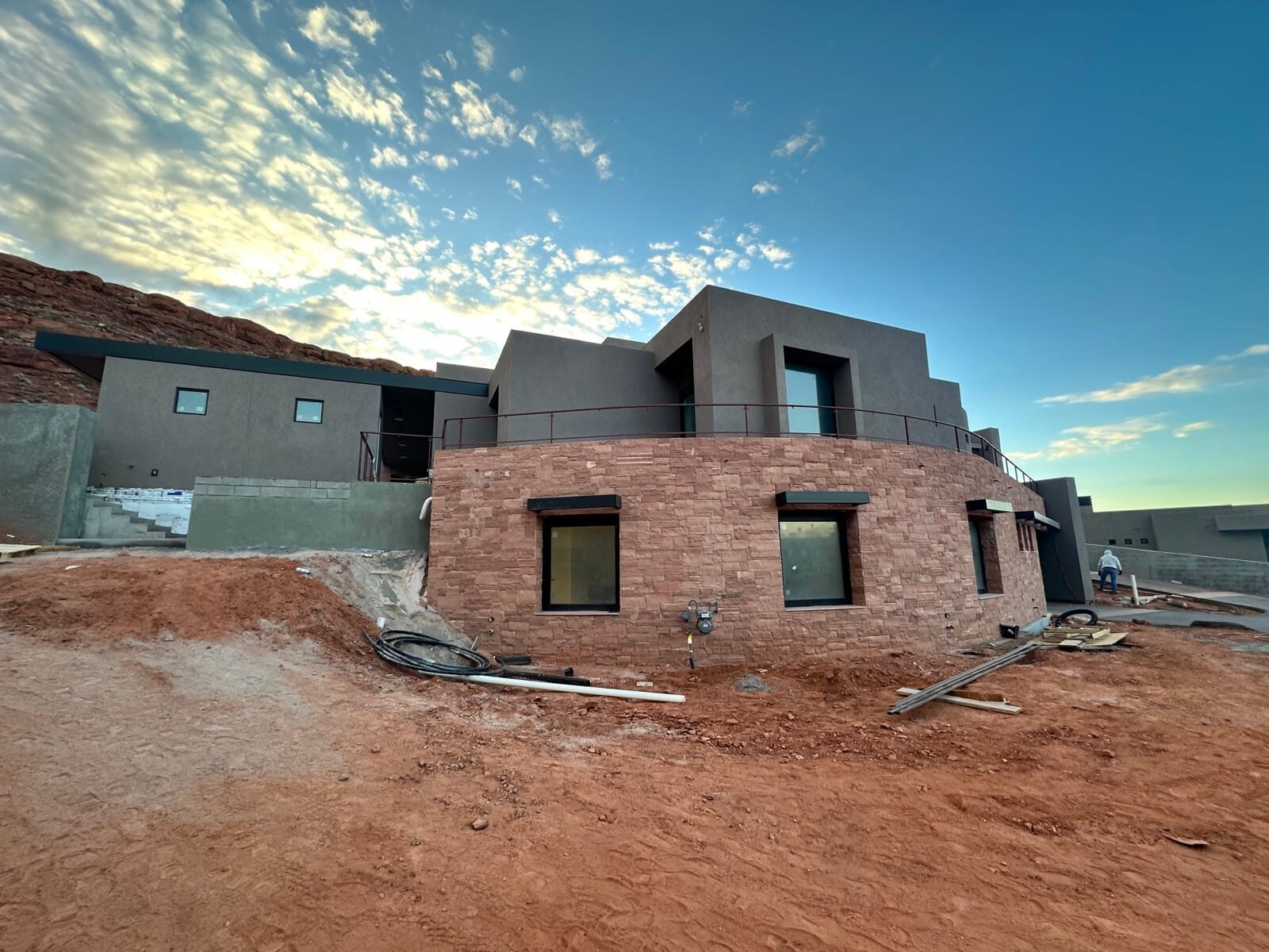 Custom radius steel railing following curved concrete at Entrada at Snow Canyon, on-site fabrication