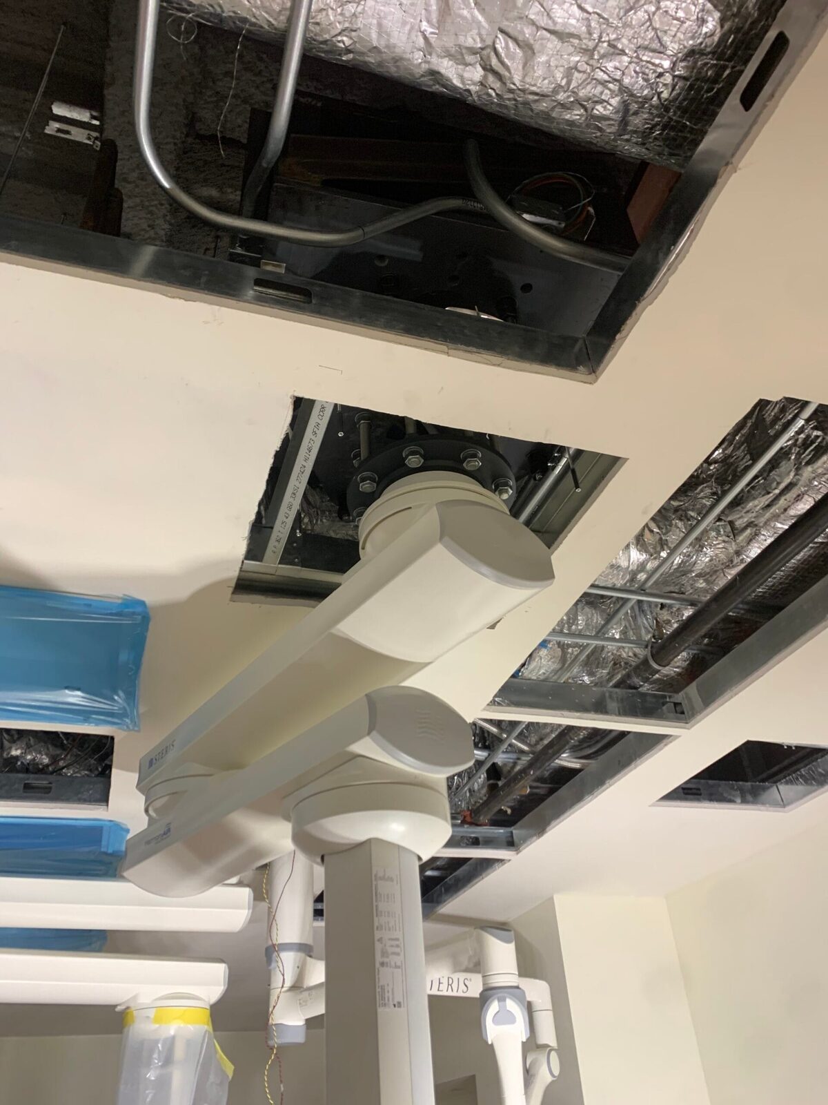 Surgical boom and equipment plate installation