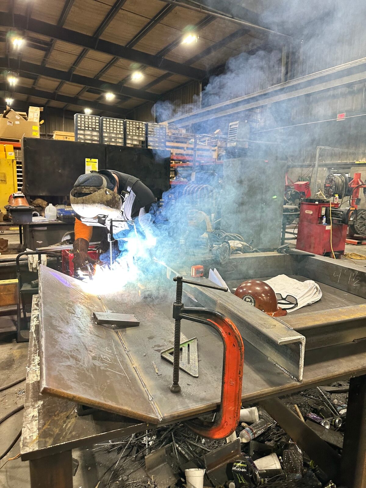 Topside fabrication of new heavy-gauge steel mine chutes and shaft supports, detail