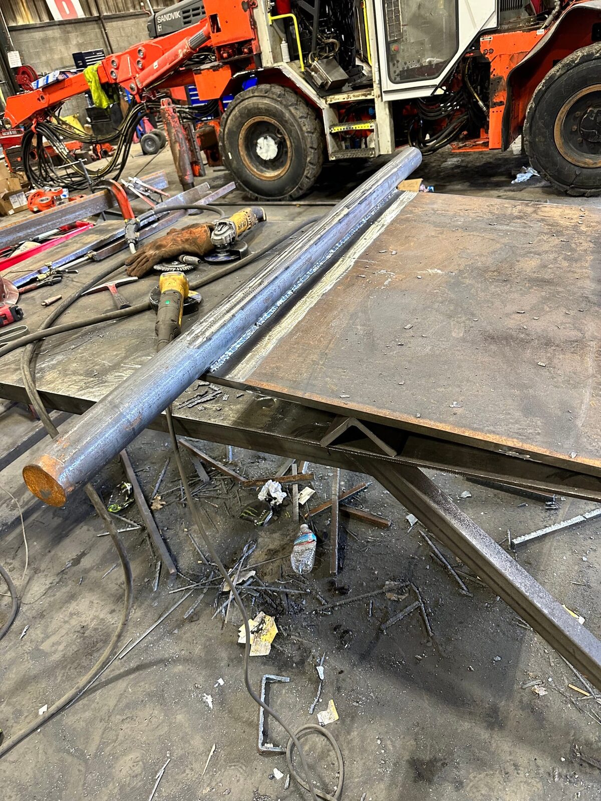 Topside fabrication of new heavy-gauge steel mine chutes and shaft supports, on-site fabrication