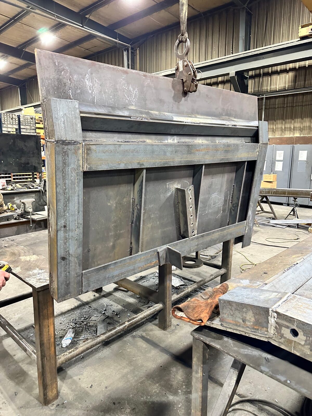 Topside fabrication of new heavy-gauge steel mine chutes and shaft supports