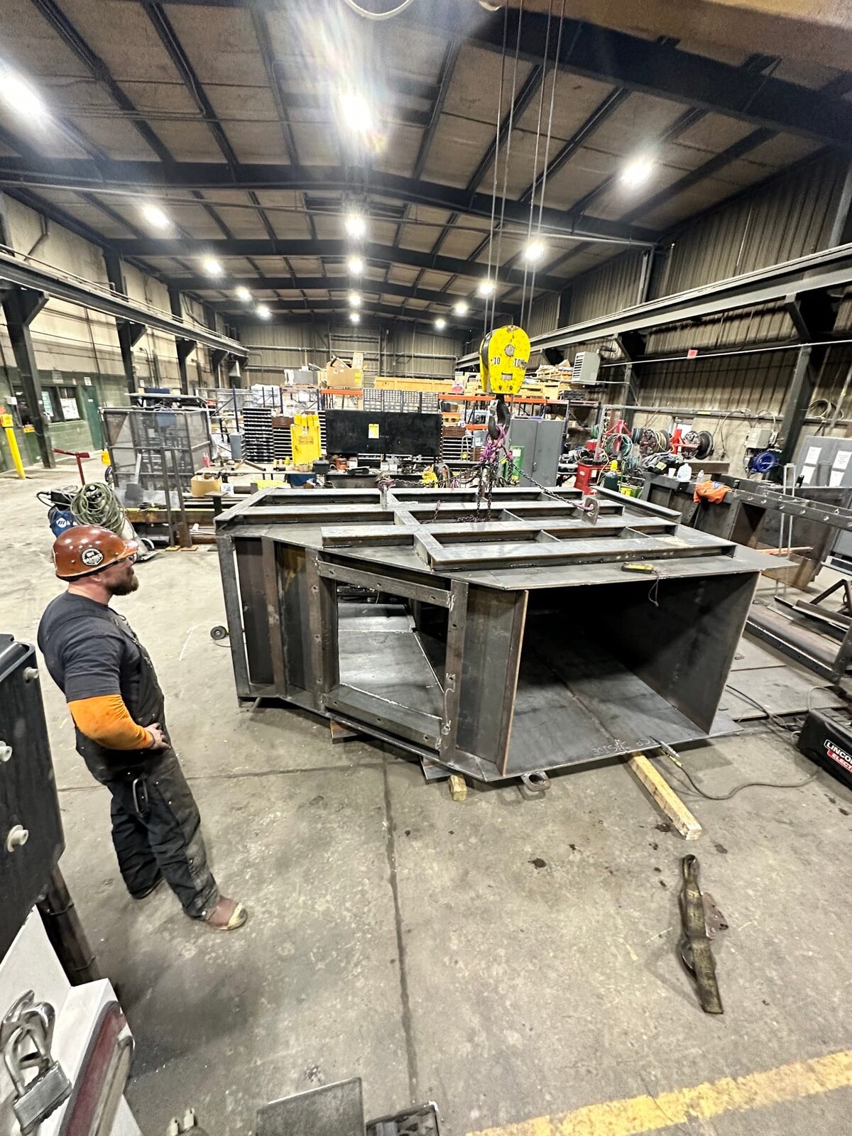 Topside fabrication of new heavy-gauge steel mine chutes and shaft supports, on-site fabrication