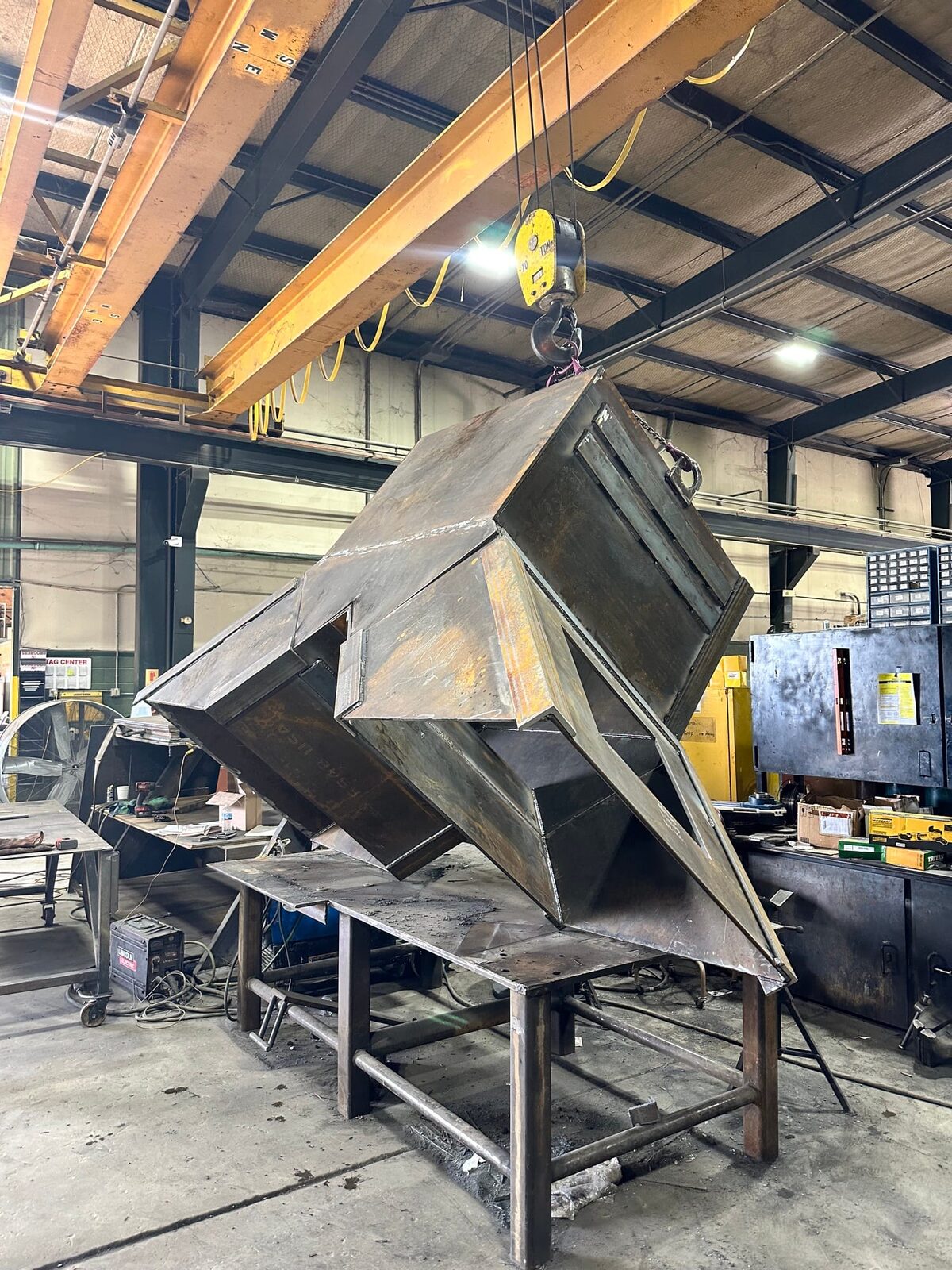 Topside fabrication of new heavy-gauge steel mine chutes and shaft supports