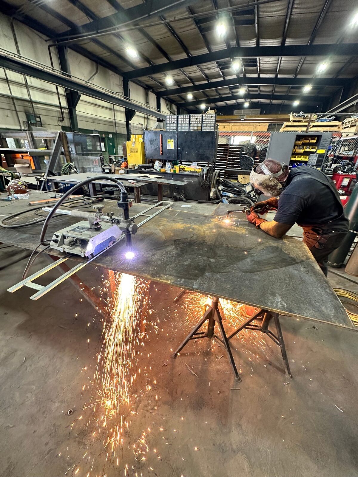 Topside fabrication of new heavy-gauge steel mine chutes and shaft supports, on-site fabrication