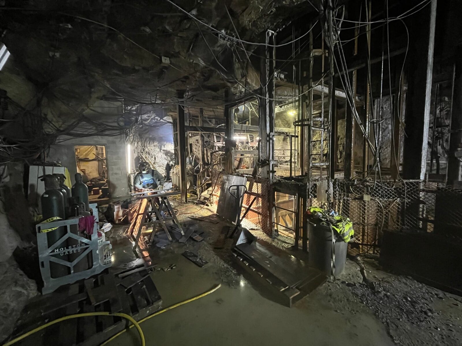 Underground crusher-assembly re-skin with custom-cut AR-500 wear plate, on-site fabrication