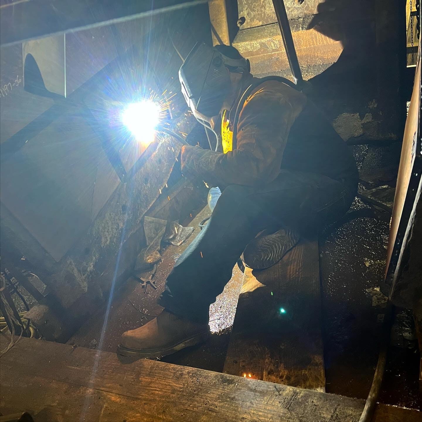 Underground crusher-assembly re-skin with custom-cut AR-500 wear plate, finished installation