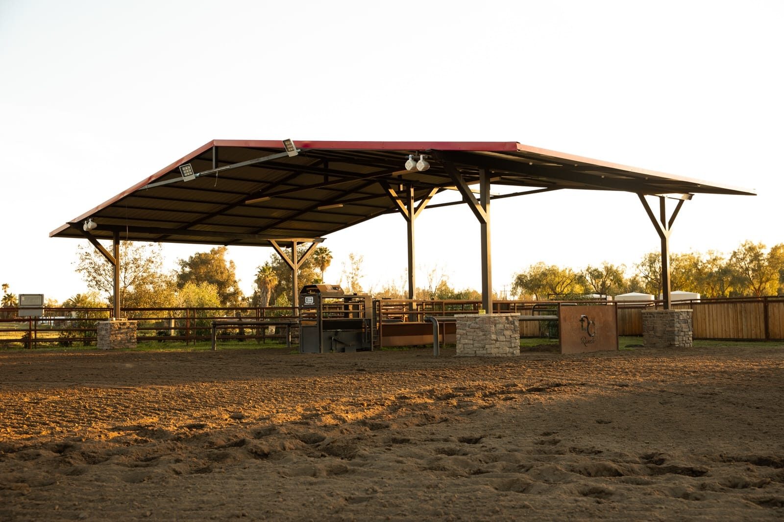Steel I-beam covered arena and shade pavilion with tube-steel columns